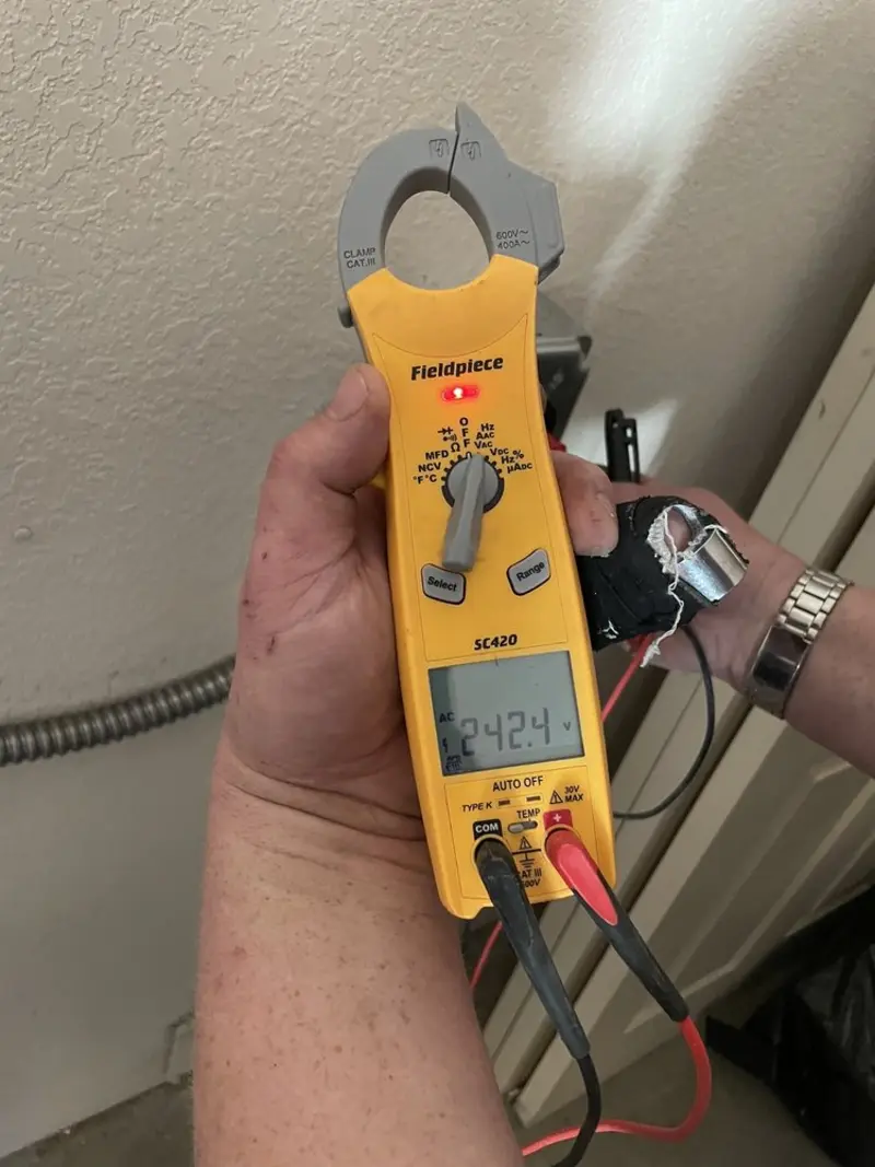 Voltage testing with clamp meter during Ceiling Fan Installation in Yeadon